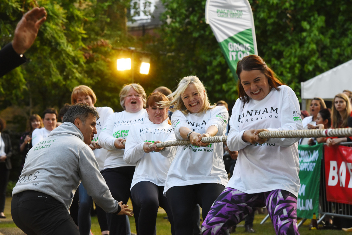 A team of fundraisers competing in a tug of war event