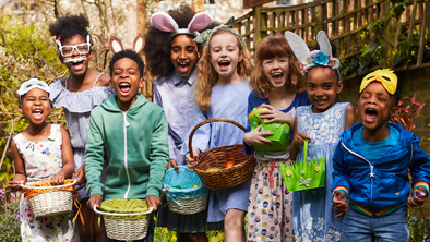 Children holding baskets ready to go on an Easter egg hunt