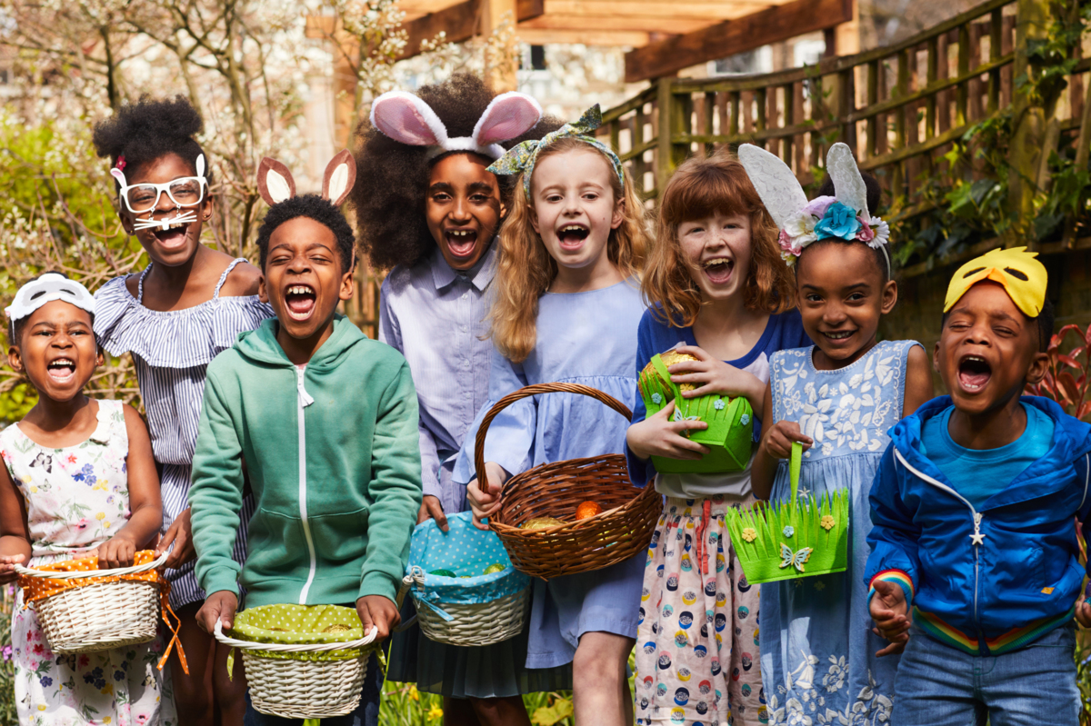 Children holding baskets ready to go on an Easter egg hunt