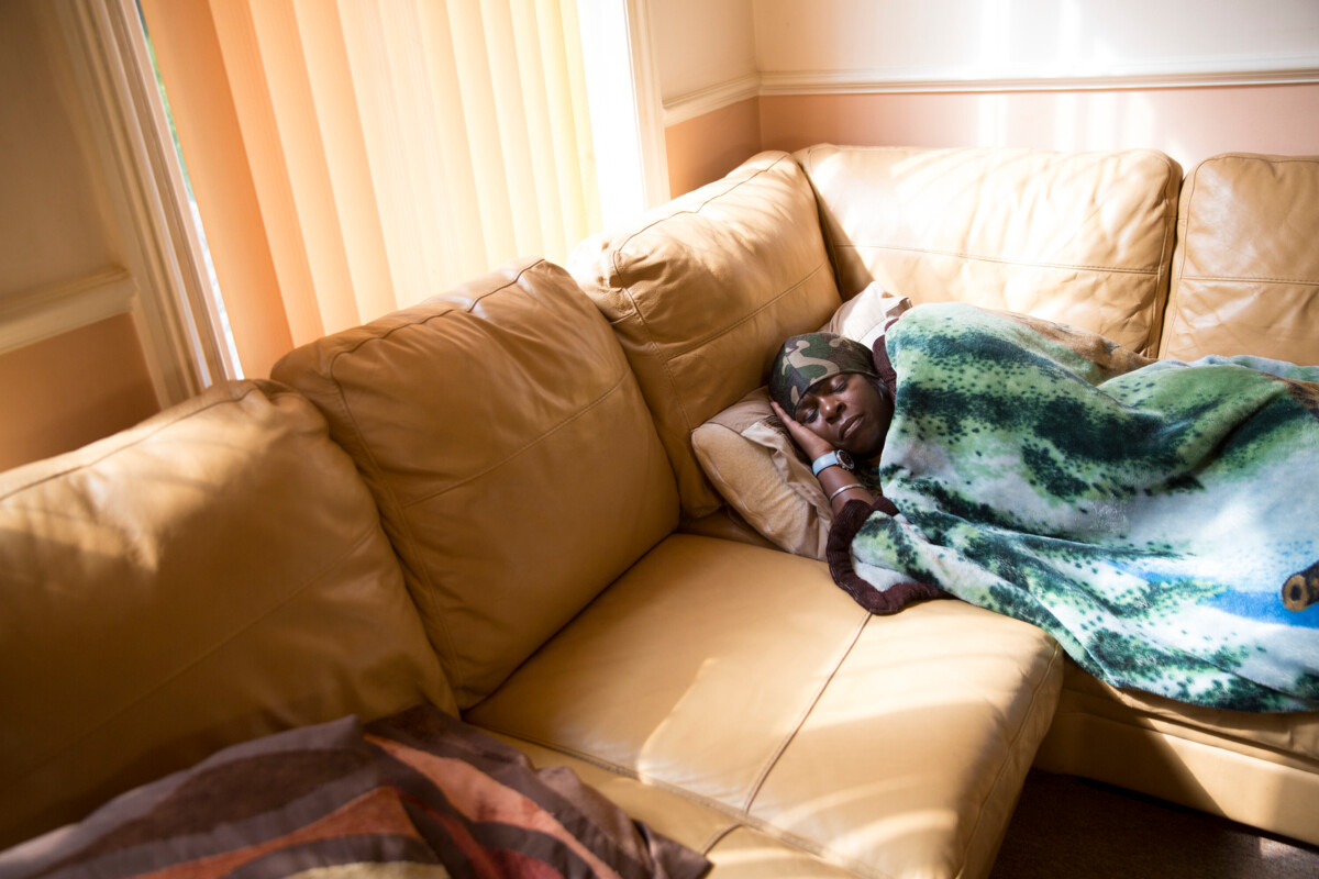 A woman sleeping on the sofa