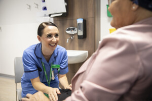 Macmillan nurse smiling at patient