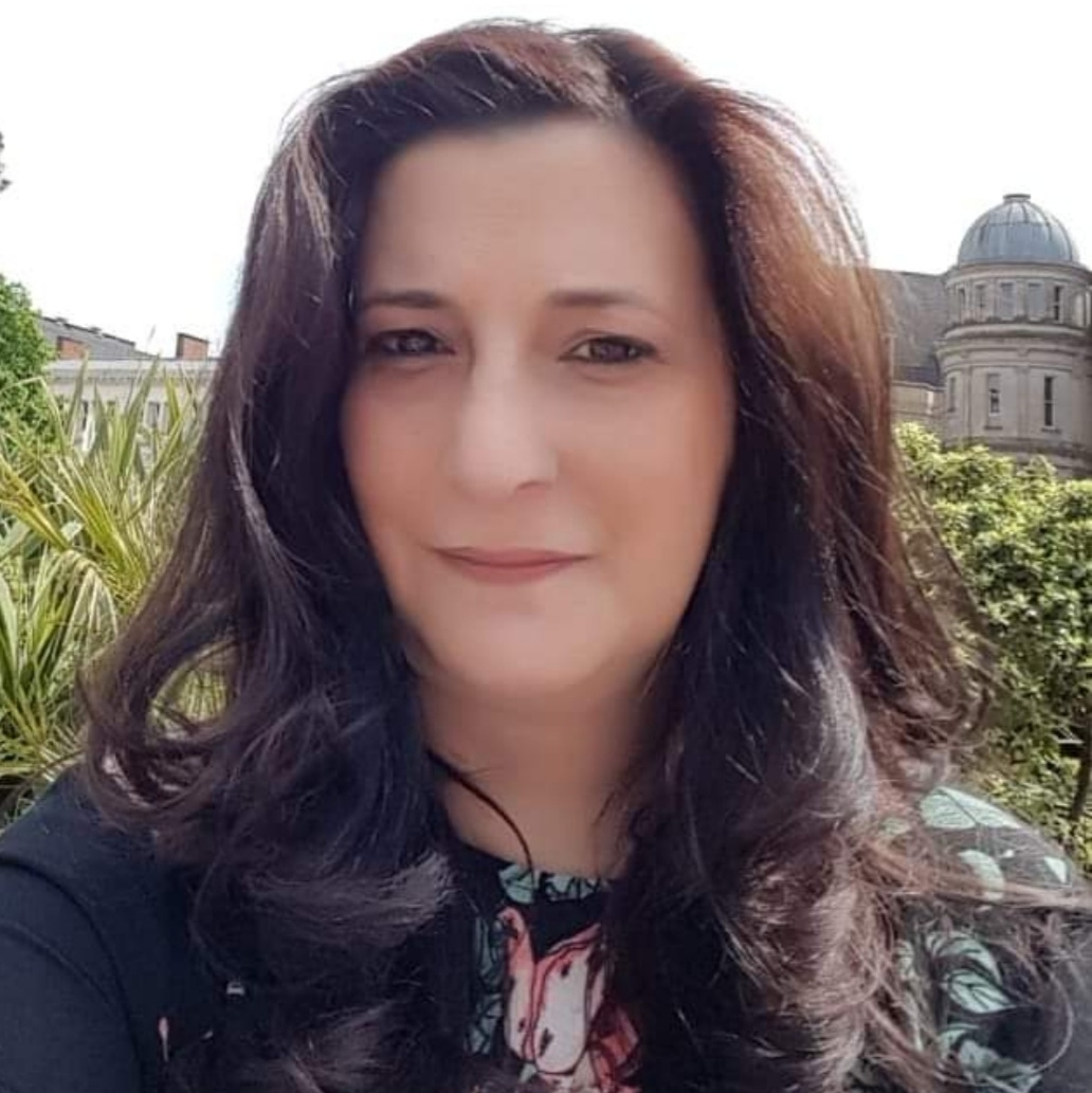 A selfie of Ameena. She is looking at the camera and appears to be outside.