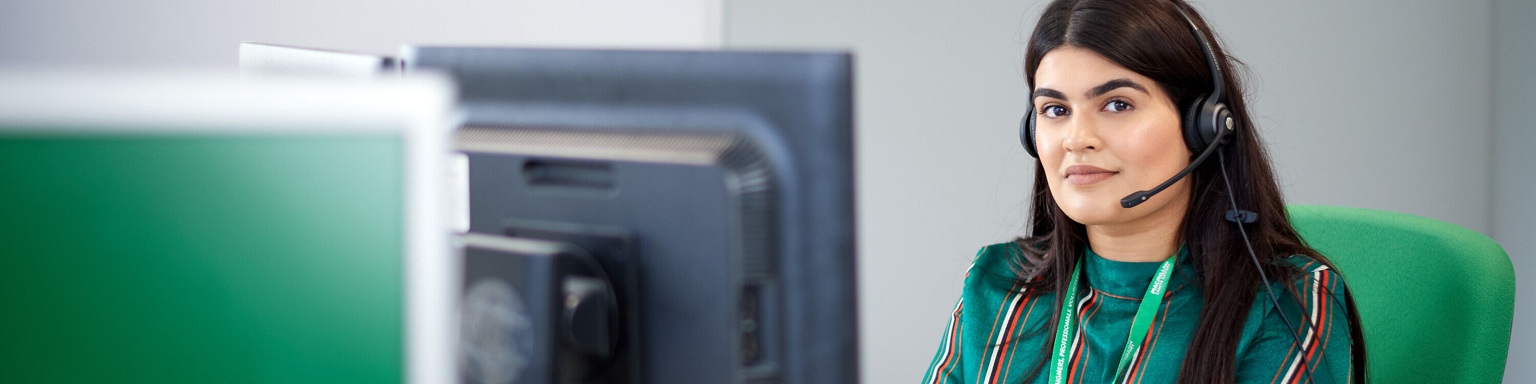 Macmillan support line employee working on computer