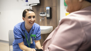 Macmillan nurse smiling at patient
