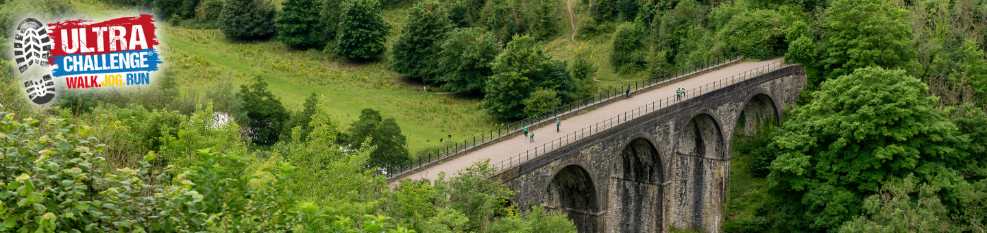 Peak District competitors holding a sign saying 25km