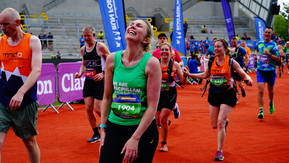 A Macmillan runner at the end of her race, looking hot and tired.