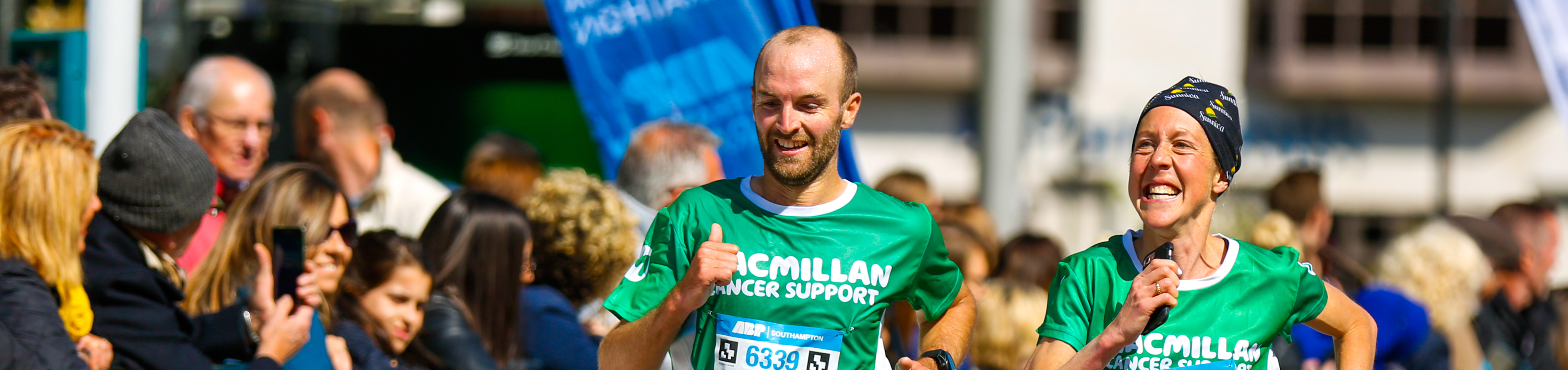 Two Macmillan runners near the finish line