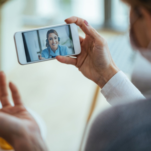 A doctor gives a virtual consultation with a patient.