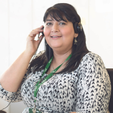 A woman taking a call on the Macmillan Support Line
