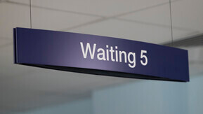 A sign for a hospital waiting room.