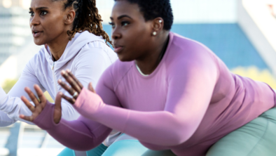 Two women doing squats