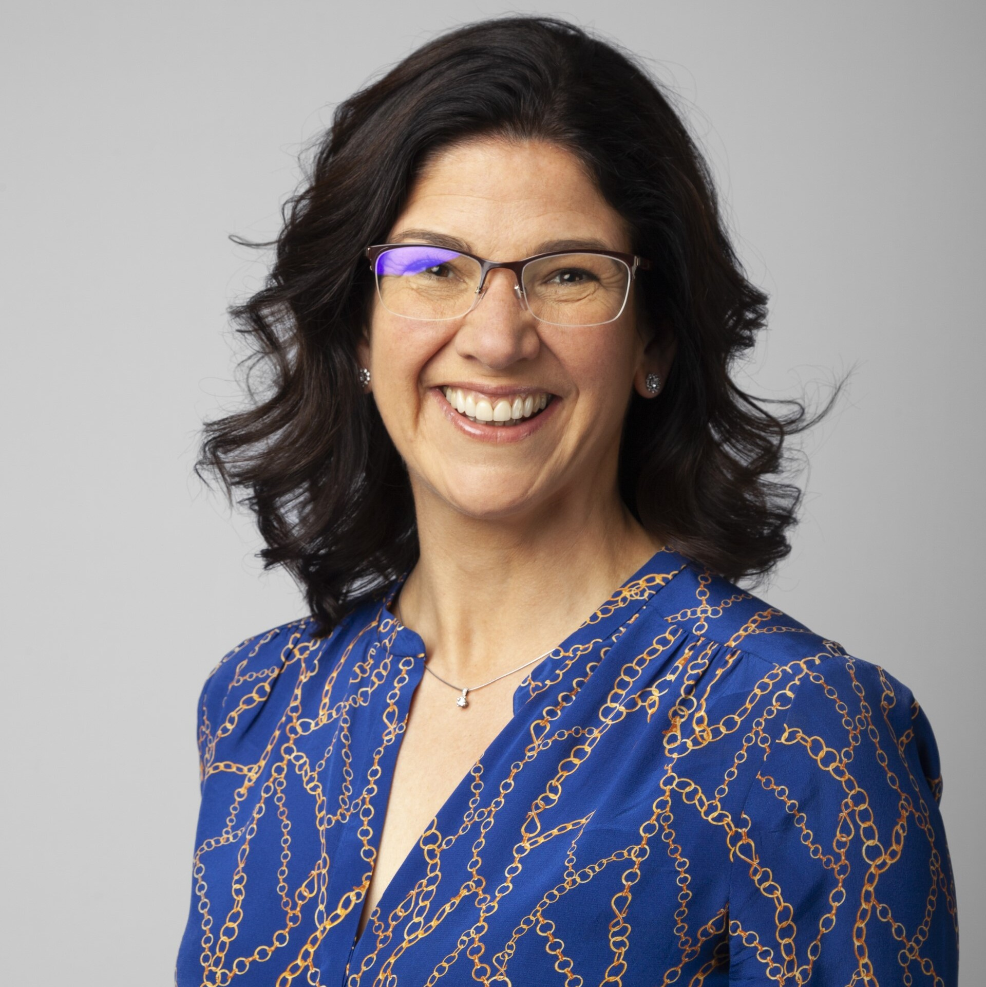 Portrait photograph of Karen looking at camera and smiling