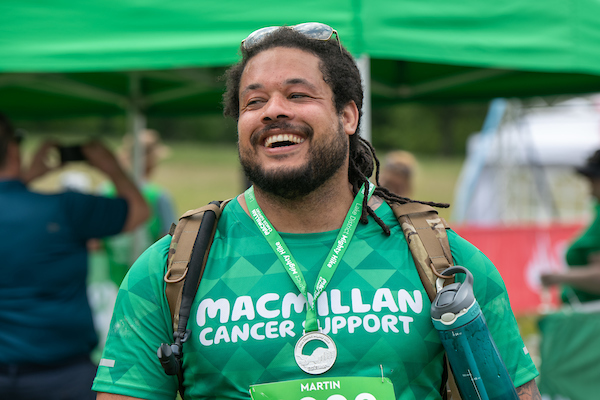 A Mighty Hiker with a medal around his neck and a big smile