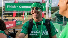 A Mighty Hiker finishing his hike and being handed a glass of bubbles
