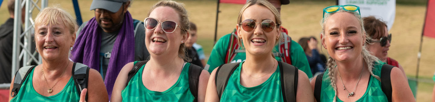 Four Mighty Hikers smiling