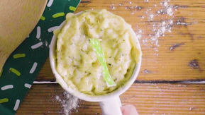 A cheese muffin in a mug fresh from the microwave