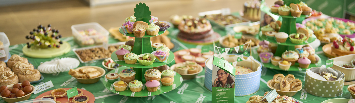 A table covered in baked good ready for a Macmillan Coffee Morning