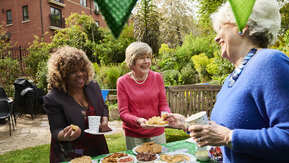 People at a Coffee Morning hosted on a garden.