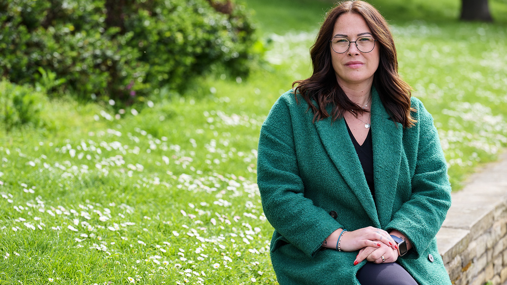 Jules, a person with incurable cancer, sitting in a park
