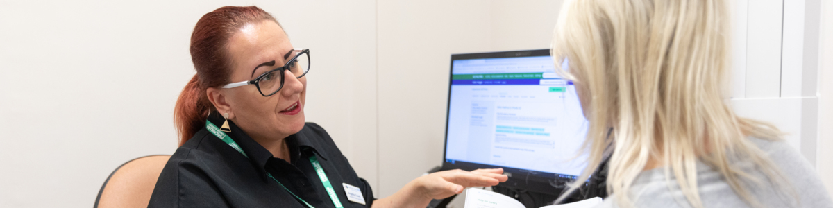 Healthcare professional in conversation with patient