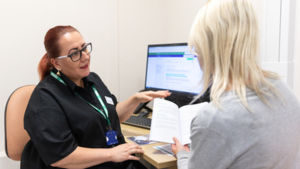Healthcare professional in conversation with patient