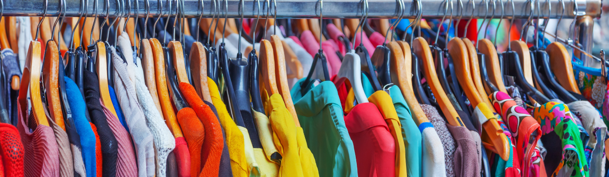 A rack of colourful clothes.