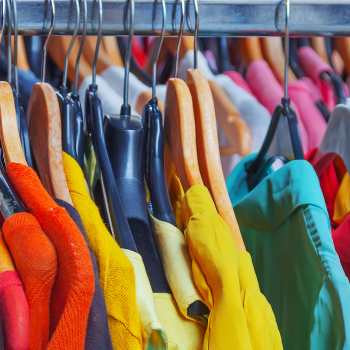 A rack of colourful clothes.