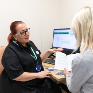 Healthcare professional in conversation with patient