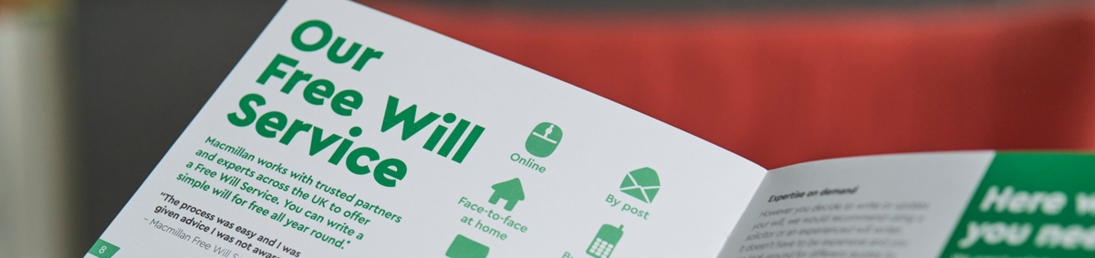 Hands holding a Macmillan brochure with the heading Our Free Will Service
