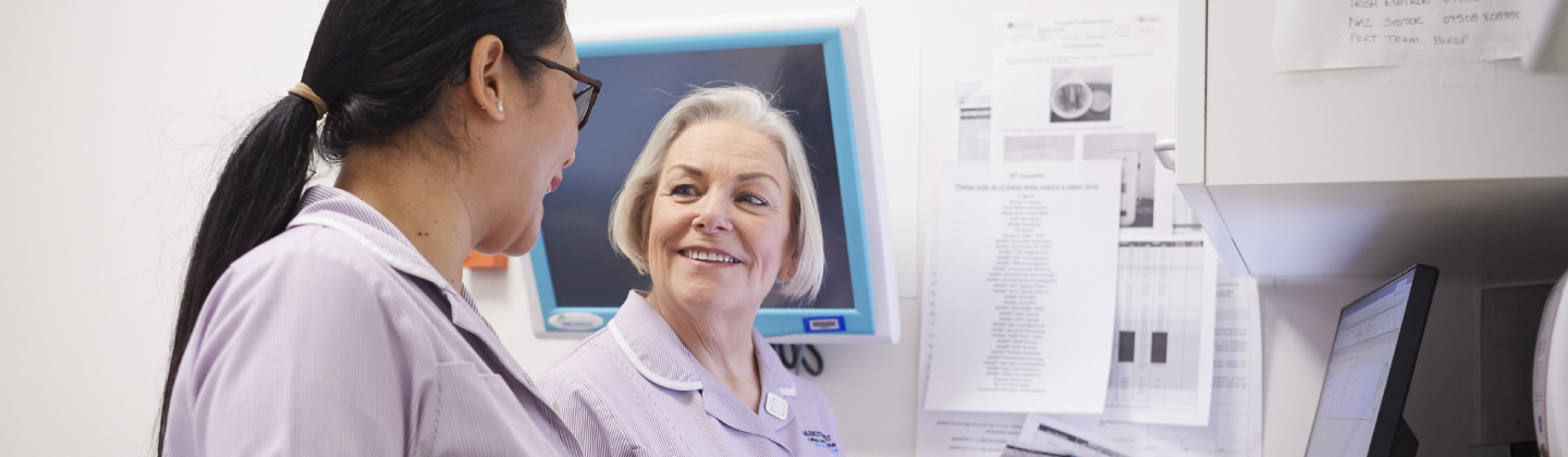 Two female healthcare professionals are talking 