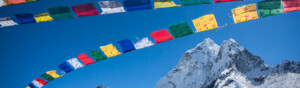 Prayer flags of different colours are blowing in the breeze near Mt Everest.