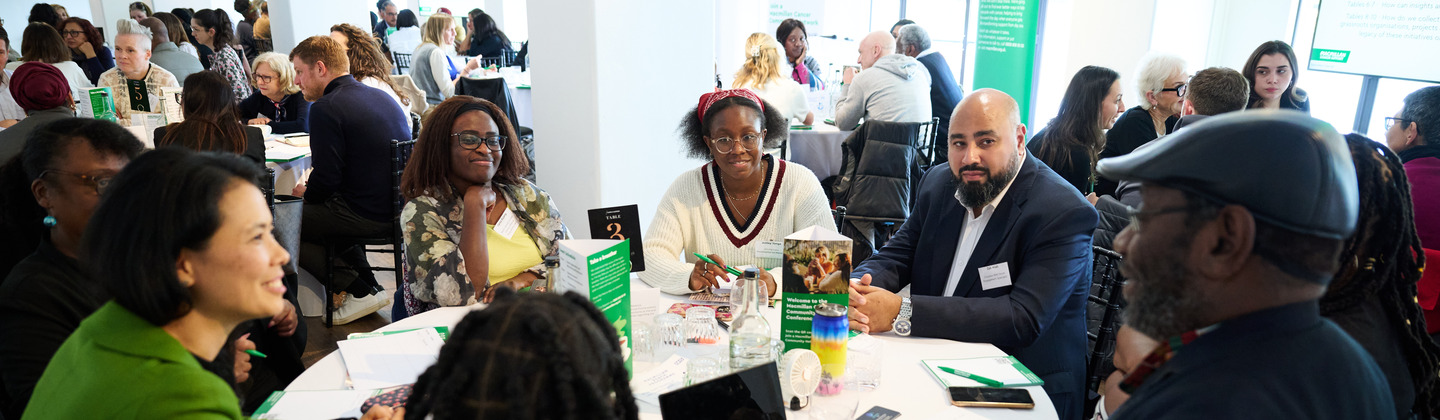 People from grassroots organisations, healthcare professionals, researchers, and representatives from cancer alliances having discussions at the Macmillan Cancer Community Networks Conference 