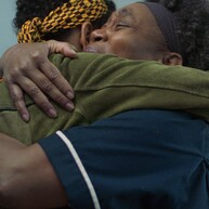Two black women hugging