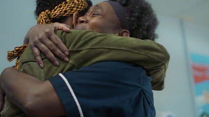 Two black women hugging