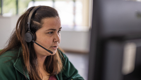 A lady working on the Macmillan Support Line.