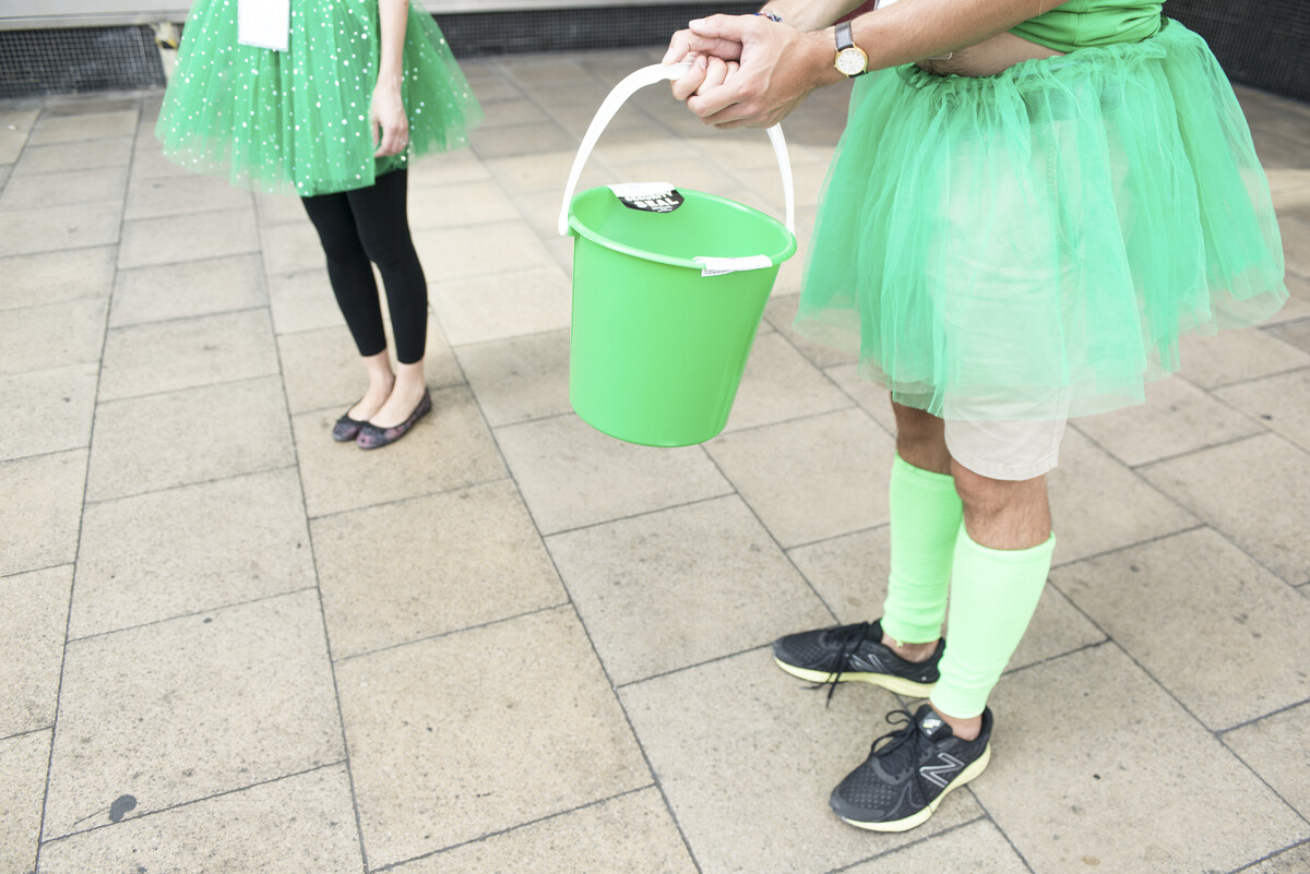 Fundraisers wearing fancy dress collecting for Macmillan Cancer Support in London