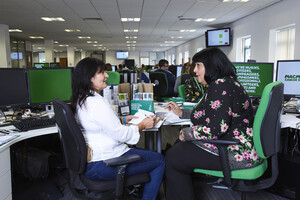 Two members of the Work Support Services Team in Shipley talking in the office