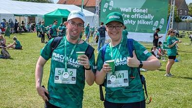 Claire giving a thumbs up and wearing a finisher's medal