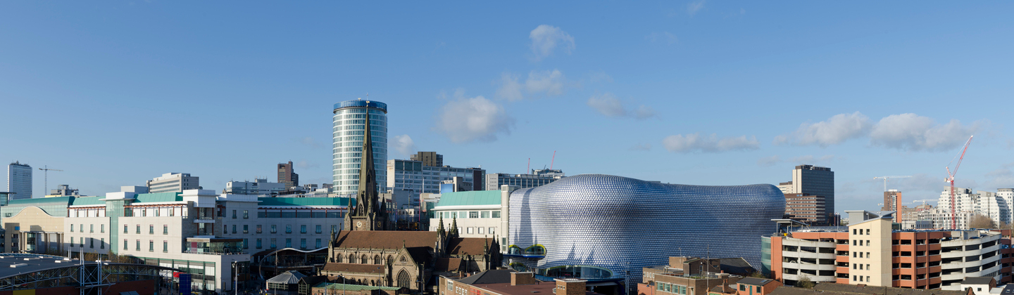 An aerial shot of Birmingham. There are many different buildings, including the famous Bullring Shopping Centre.