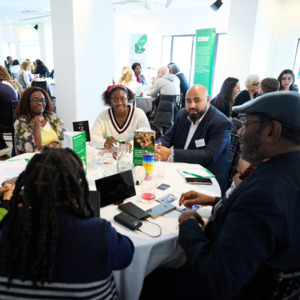 People from grassroots organisations, healthcare professionals, researchers, and representatives from cancer alliances having discussions at the Macmillan Cancer Community Networks Conference 