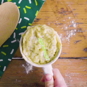 A cheese muffin in a mug fresh from the microwave