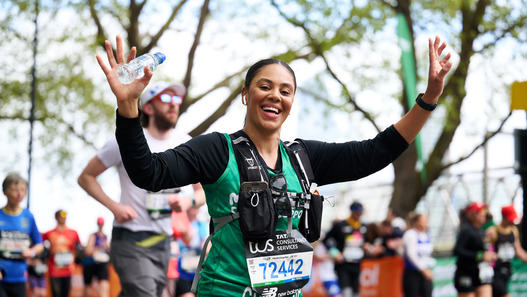 A woman running the London Marathon 2024