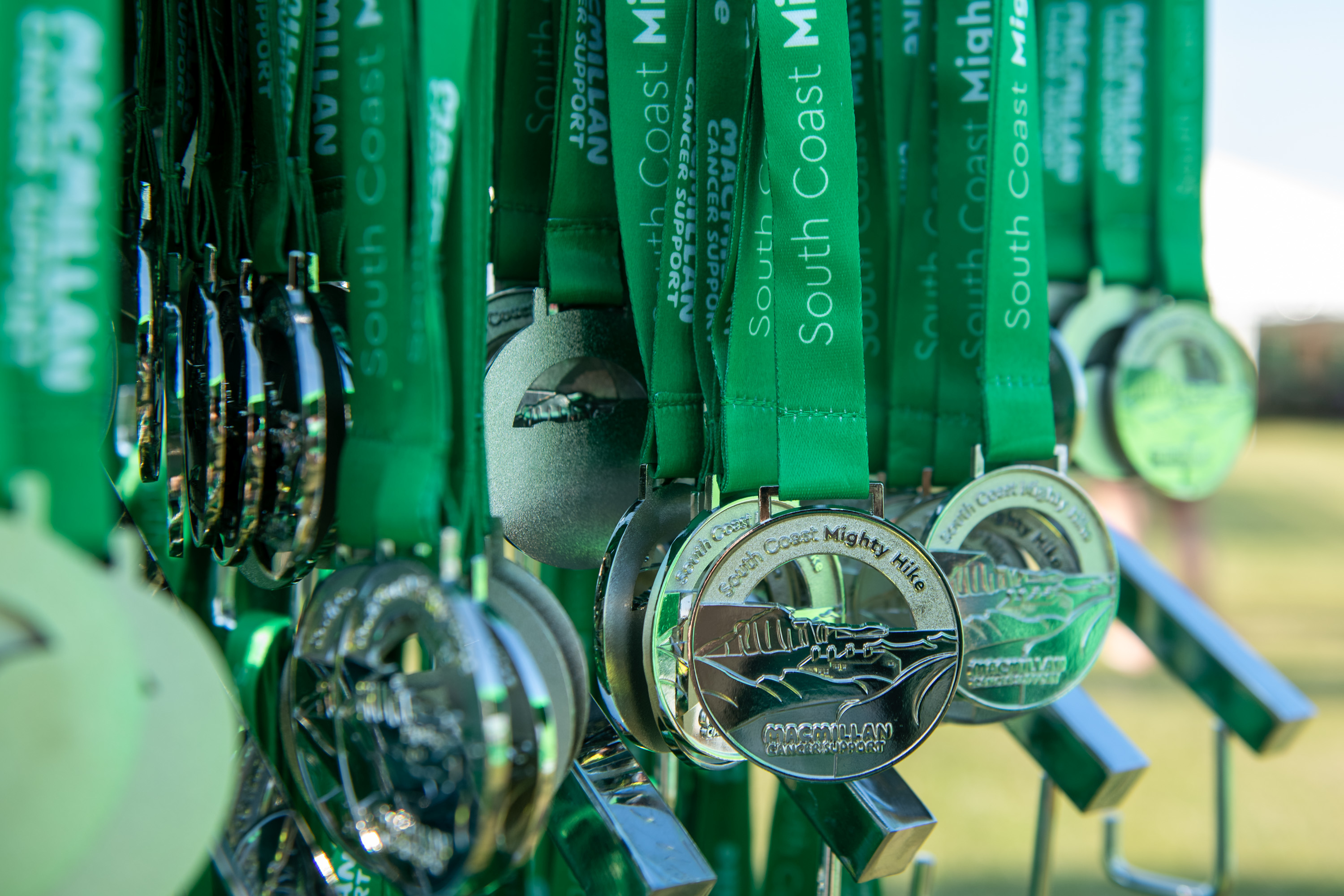 Lots of Mighty Hikes medals waiting to be handed out