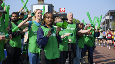 Macmillan volunteers at a running cheerpoint