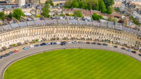 An aerial view of the city of Bath. It shows the famous Royal Crescent. 