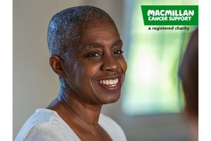 A booklet cover with a woman smiling at someone just out of picture and the Macmillan logo. Text says Health, social and community professionals' guide to Macmillan services for people with cancer