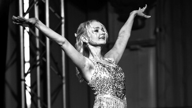 Kimberley on stage at a gala