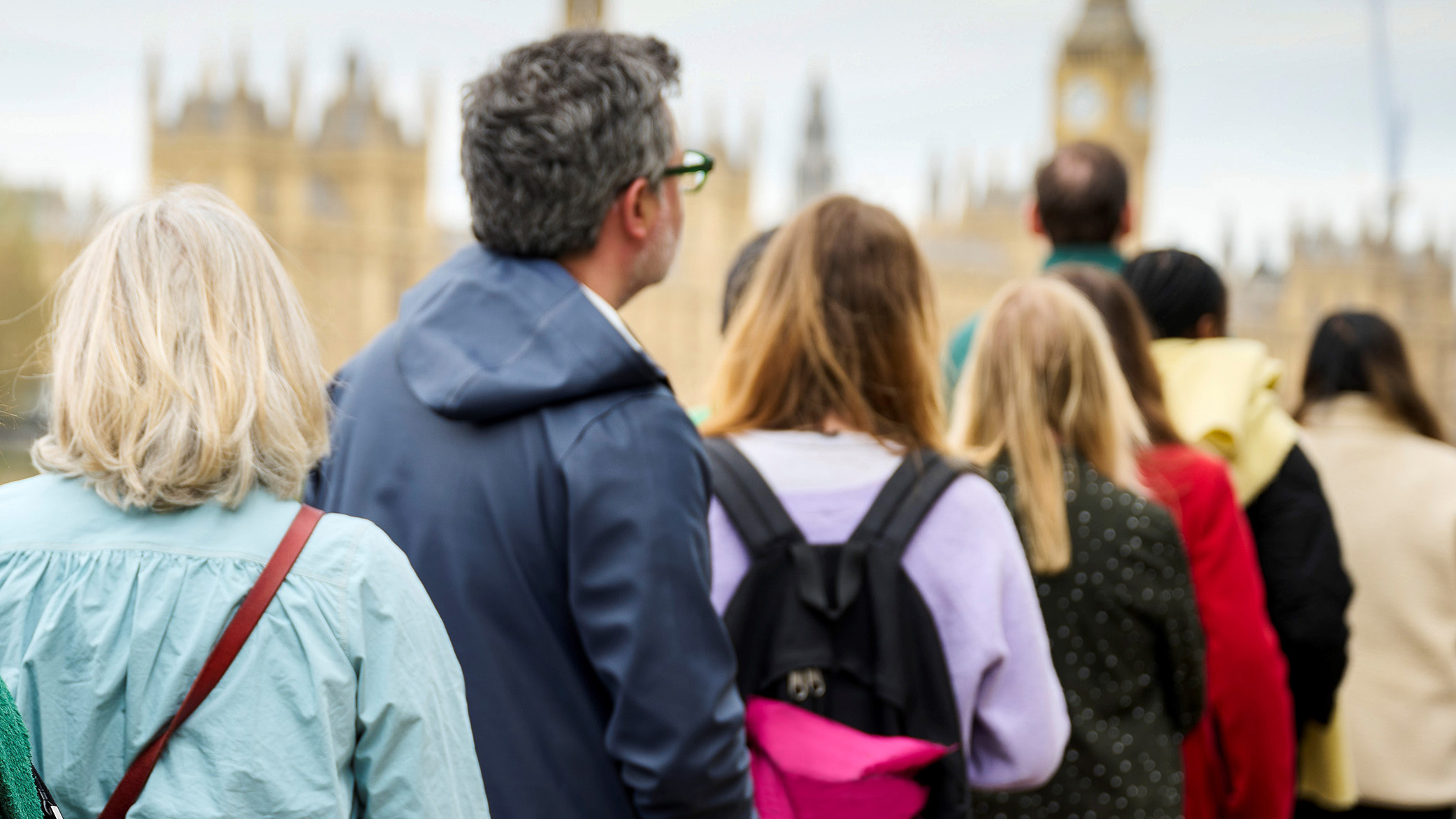 People queueing outside parliament.