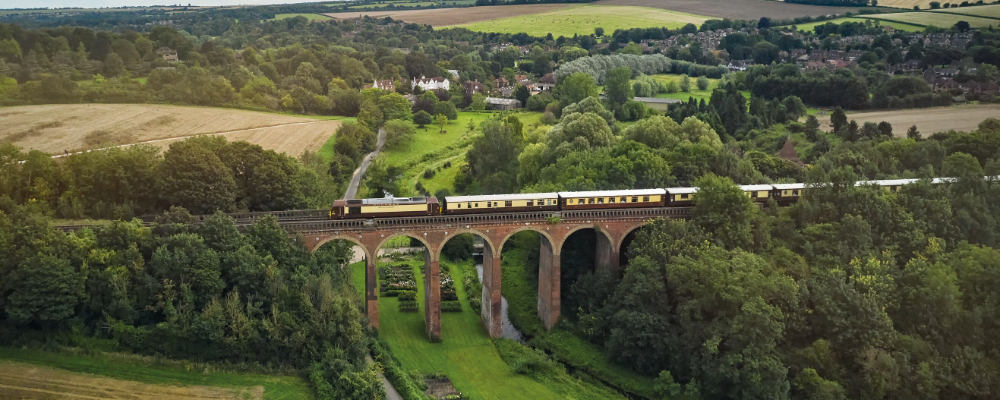 Belmond British Pullman going over a viaduct
