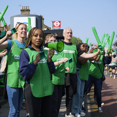 Macmillan volunteers at a running cheerpoint